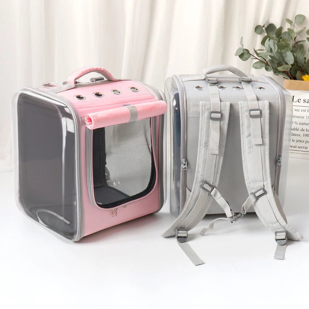 Cat carrier backpack in pink and gray colors with breathable mesh panels and adjustable straps for small pets.