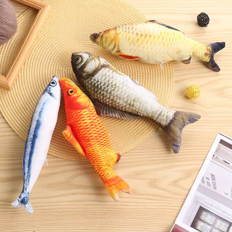 Fish-shaped catnip chew toys in realistic plush design on a wooden surface.