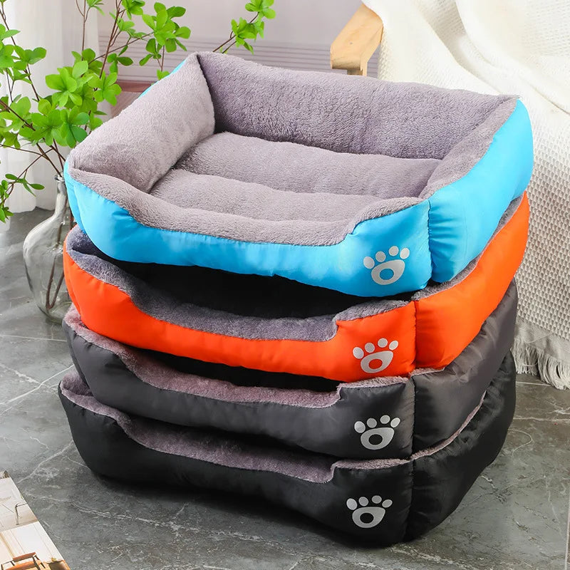 Breathable cat bed in colorful squares, lightweight and washable, perfect for warmth and style.