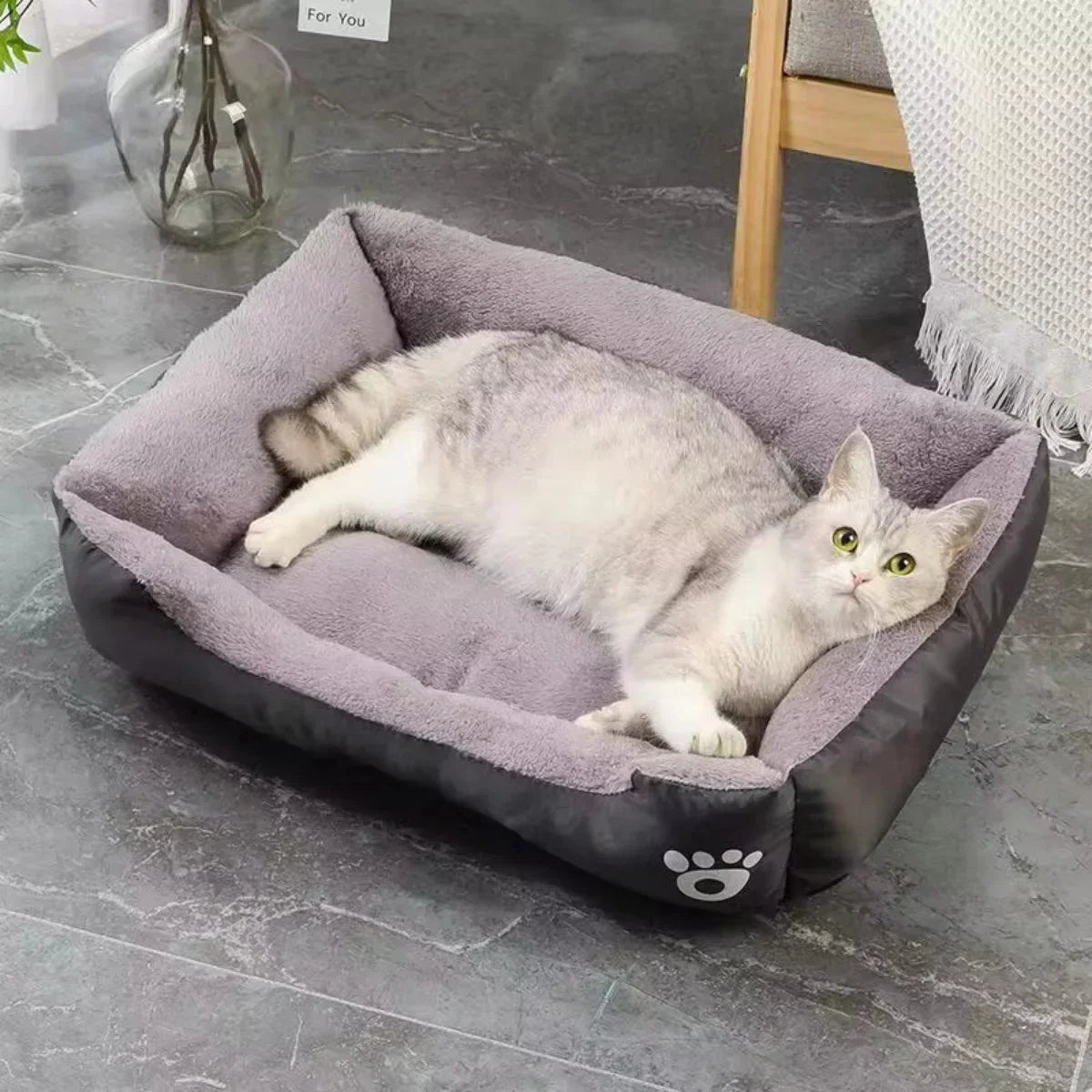 Breathable color square cat bed with a plush interior for warmth and comfort.