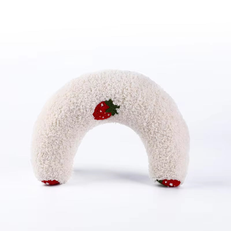 U-Shaped cat pillow with plush texture and strawberry design.
