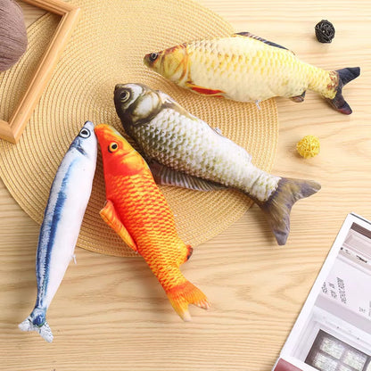 Fish-shaped catnip chew toys in realistic plush design on a wooden surface.