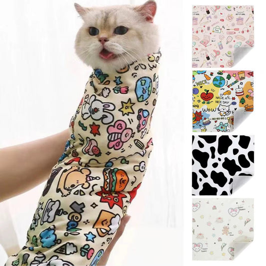 Cat in colorful CatchCat™ Grooming Wrap, surrounded by fabric pattern options; prevents biting and scratching, ideal for grooming.