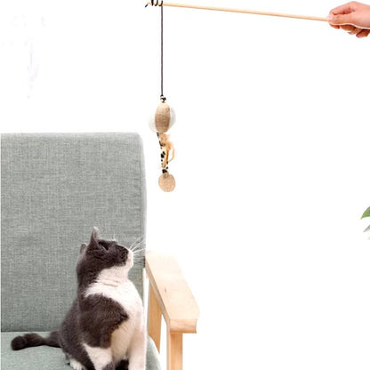 Colorful feather cat toy with long wand, engaging kitten in playful interaction.